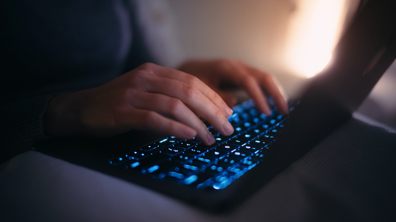 hands at a laptop