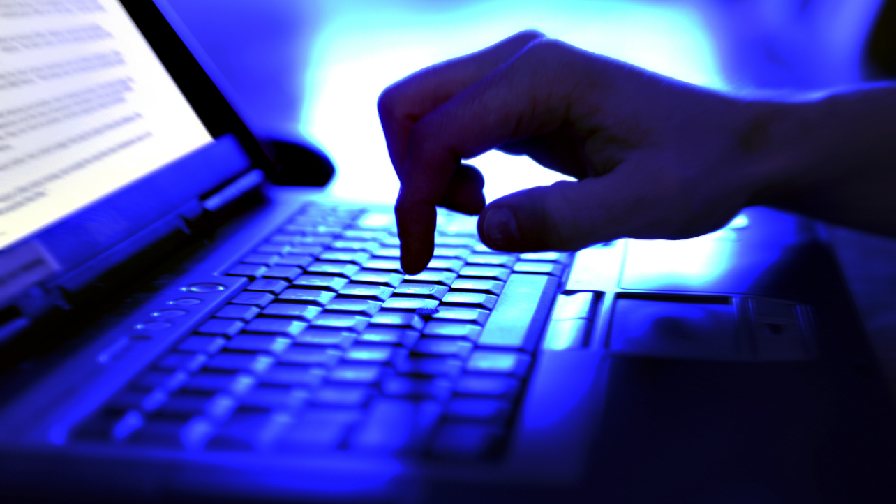 Person typing on laptop